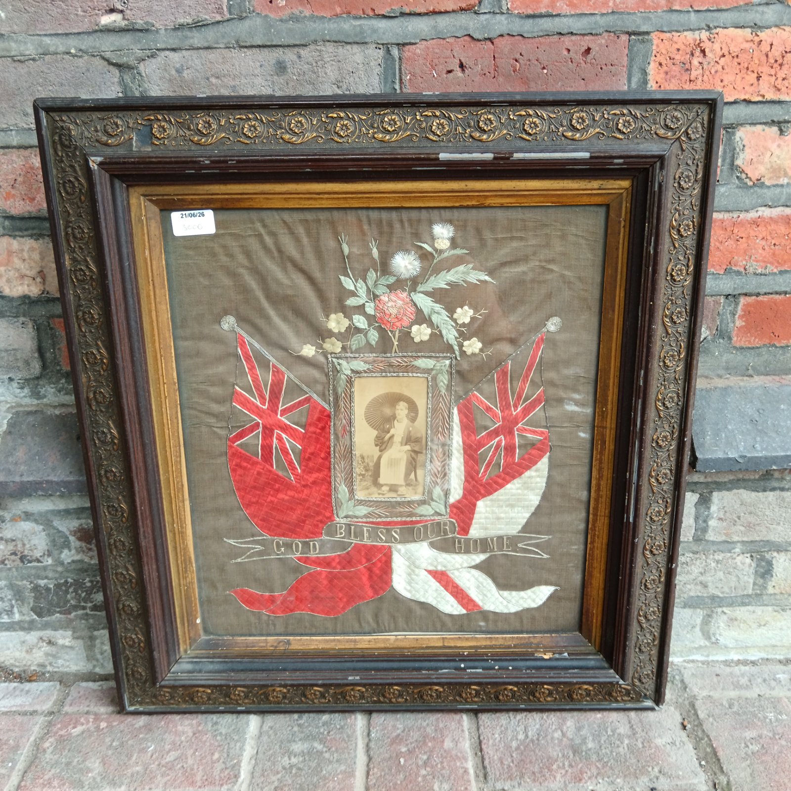 Antique 19th-century silk embroidery panel with "God Bless Our Home" inscription.