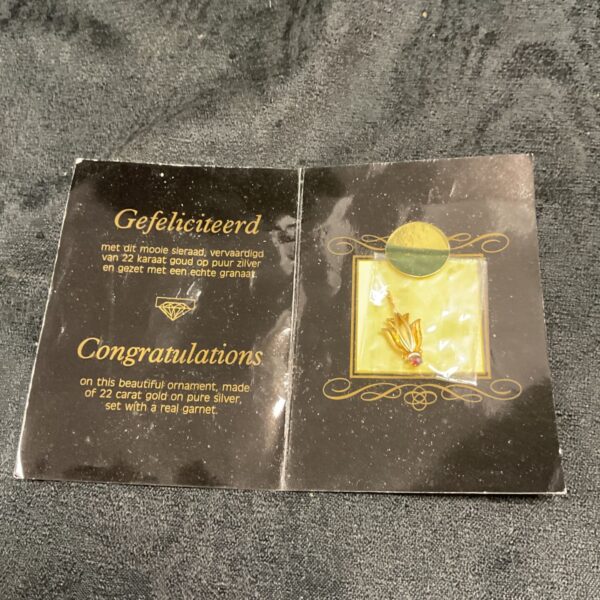 Vintage 22ct gold and silver pendant with a garnet stone.