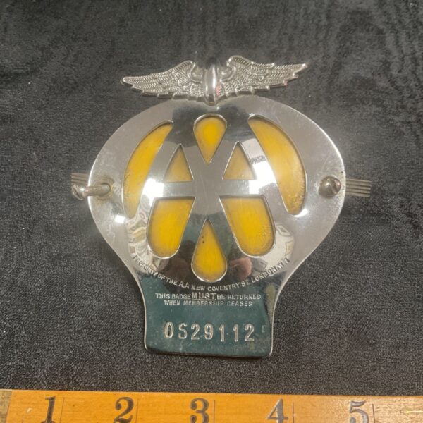 Vintage AA car grille badge, classic motoring emblem.