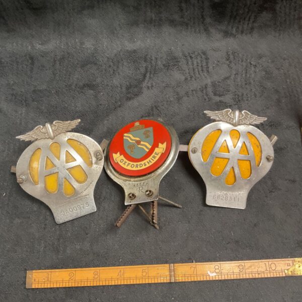 Vintage AA and Oxfordshire car badges for collectors.