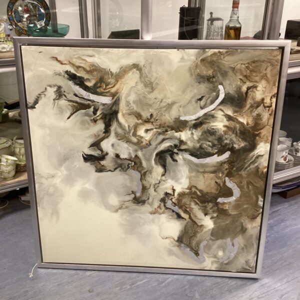 Large abstract canvas art with a silver frame for modern wall decor.