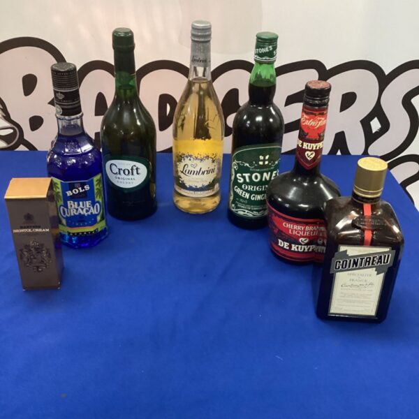 Unopened bottles of alcohol including Croft Sherry and Blue Curacao.