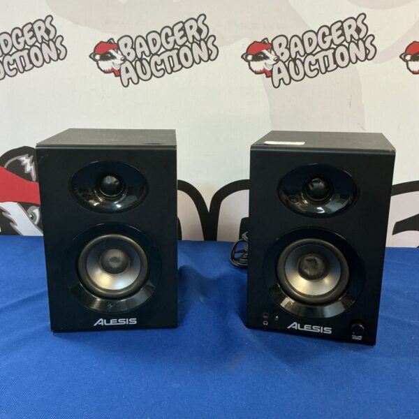 Pair of black Alesis Elevate 3 studio monitor speakers.