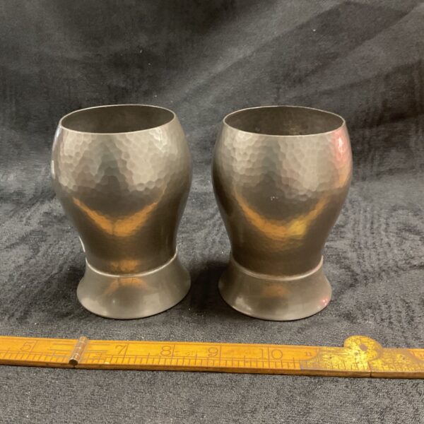 Antique pewter goblets by Alexander Clark, hammered texture visible.