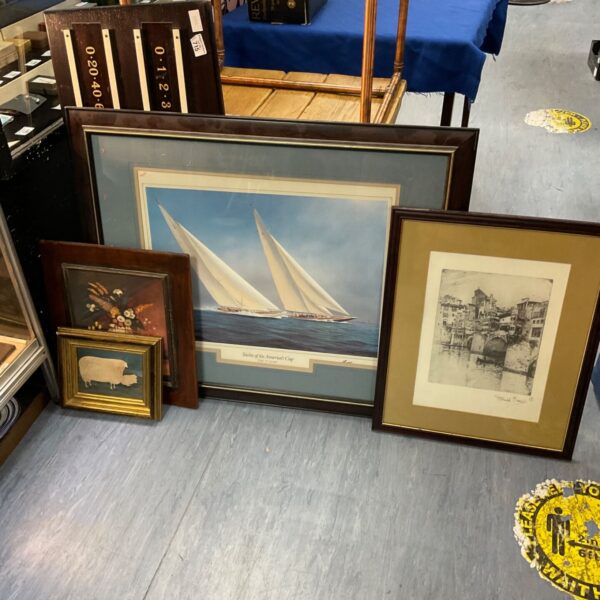 Framed print of a yacht racing in The Americas Cup.