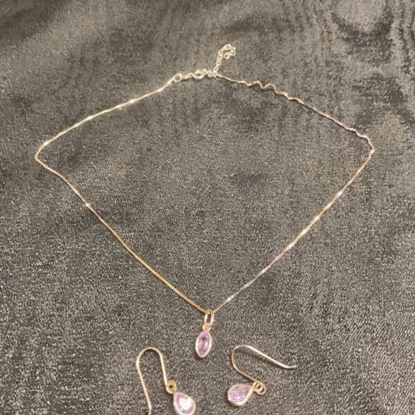 Silver necklace with amethyst pendant and matching earrings set.