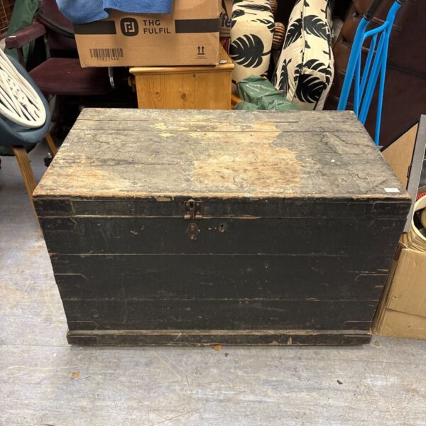 Antique wooden blanket box with green paint and iron hardware.