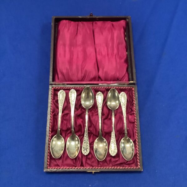 Antique continental teaspoons in a red-lined case.
