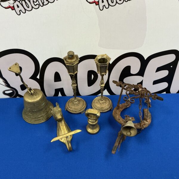 Antique iron doorbell and brass candlestick lot, Victorian era collectibles.