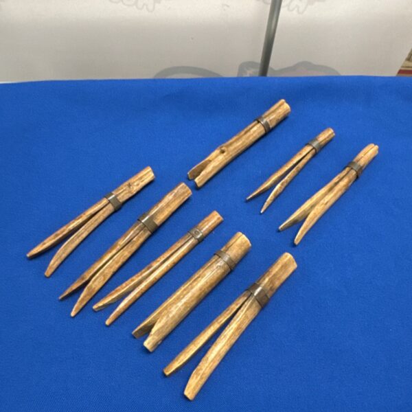 Antique gypsy pegs with iron banding for securing tents.