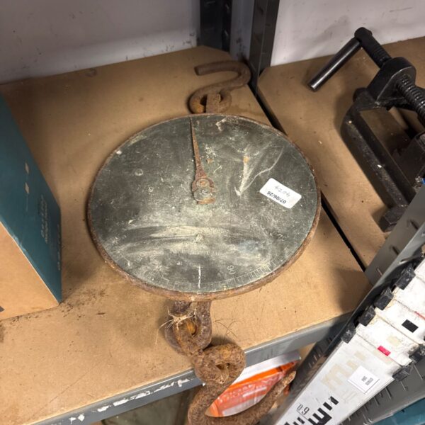 Antique Herbert & Sons hanging scales with a weathered circular pan.