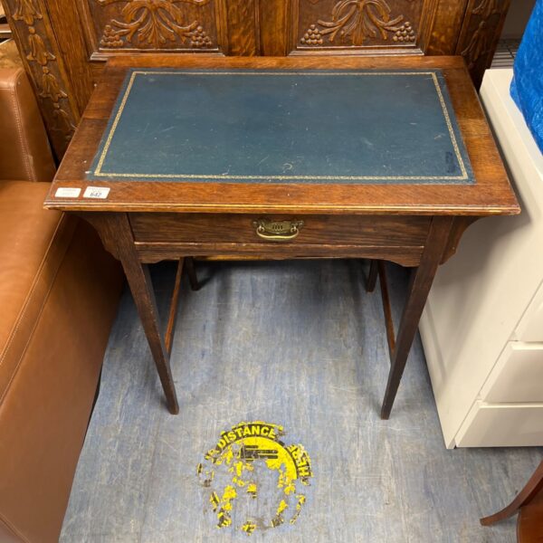 Antique mahogany writing table with green leather top and single drawer.