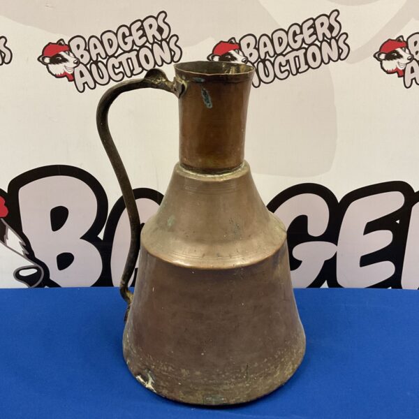 Antique Middle Eastern copper ewer with a beautiful patina.