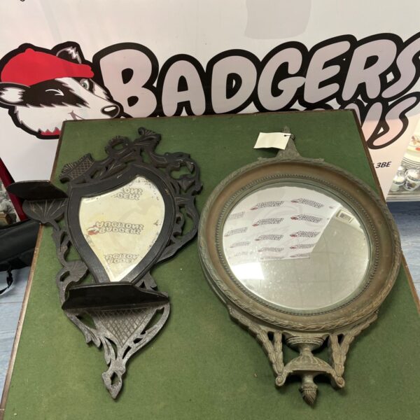 Ornate antique mirrors with gilded frames, a vintage home decor item.