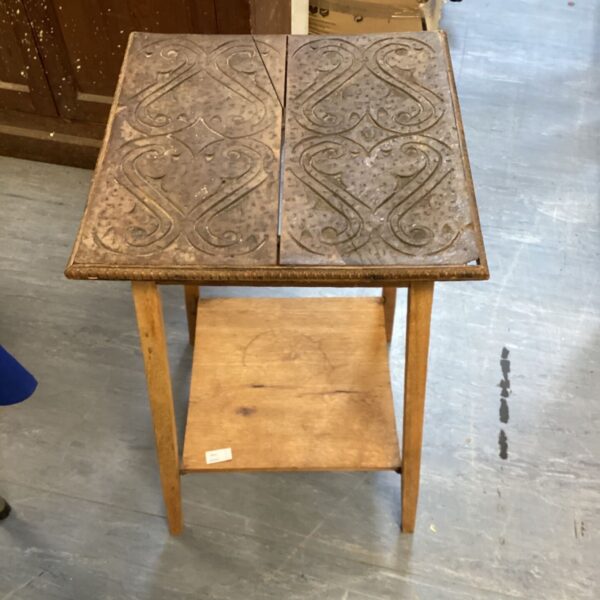 Antique mosaic table with inlaid wood floral design.