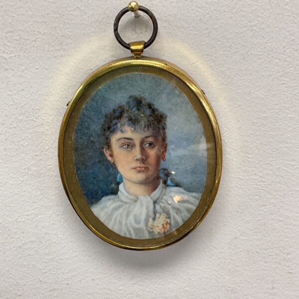 Antique oval portrait painting of a young woman in oil.