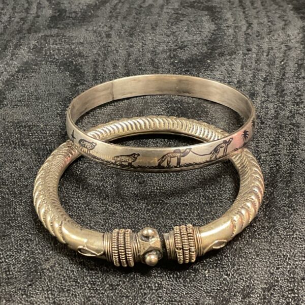Antique silver bracelets, featuring a tribal Kadla and Egyptian revival bangle.