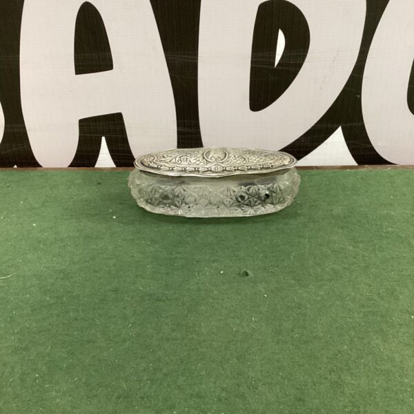 Antique silver toothpick case with crystal body and embossed lid.