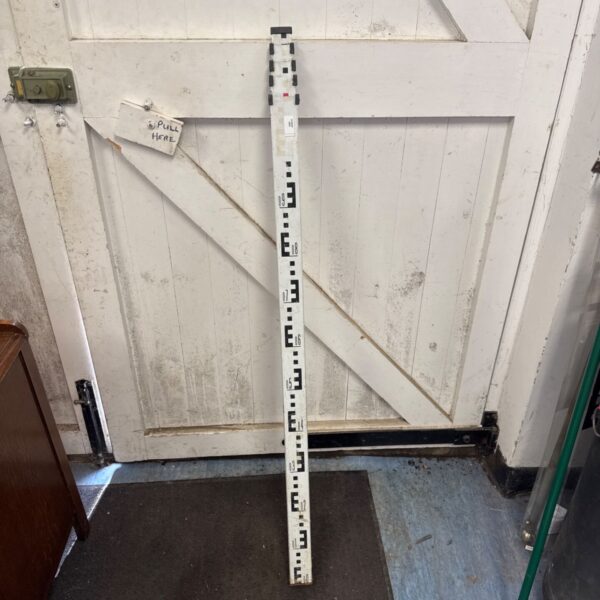 Antique surveyors extendable gauge for land measurement.