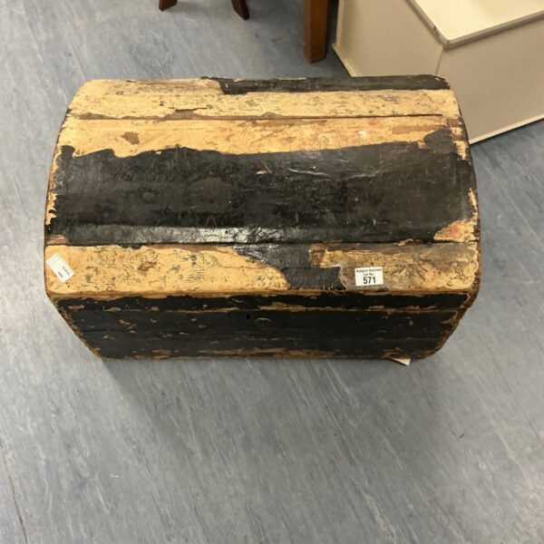 Antique wooden trunk with weathered paint and vintage character.
