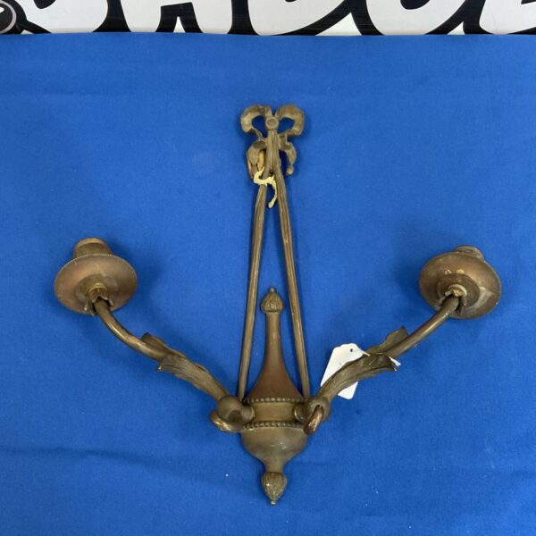 Antique Art Nouveau copper wall sconce with candle holders.