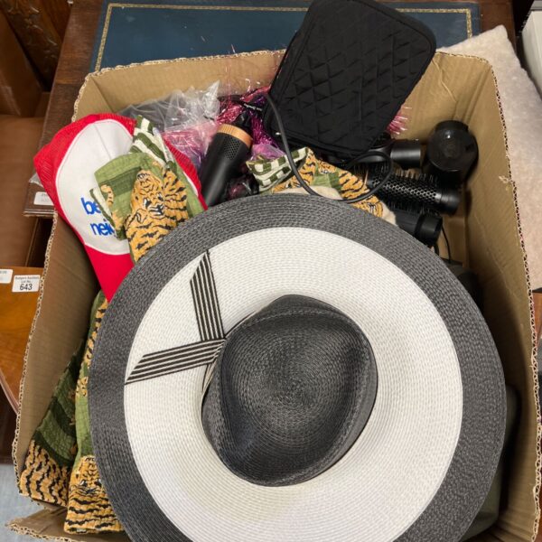 Assorted vintage hats and a hair curler in a box.