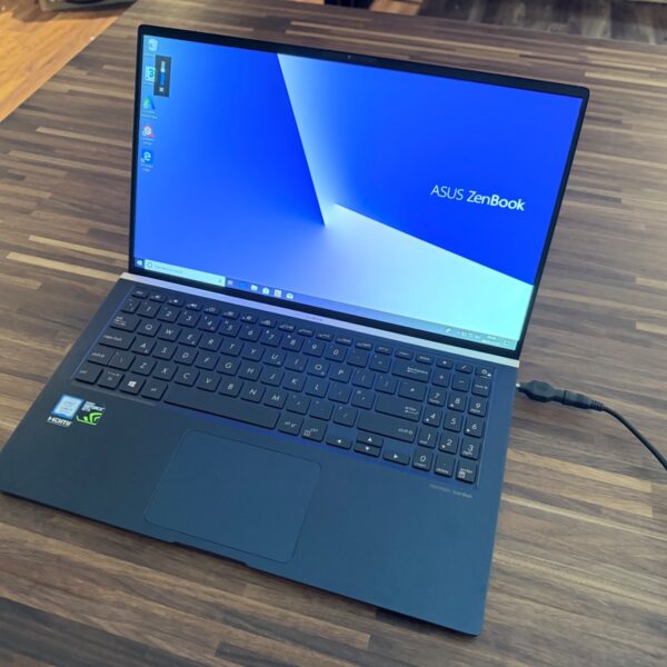ASUS ZenBook UX533F laptop showing the screen and keyboard.