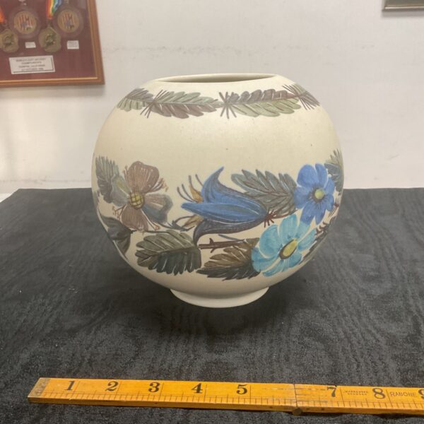 Hand-made Austrian studio pottery bowl with floral design.