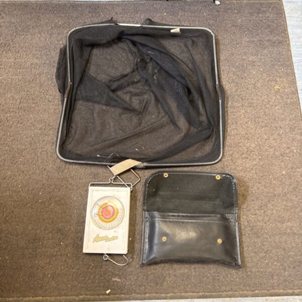 Vintage Avon fishing scales with a mesh bag for angling.