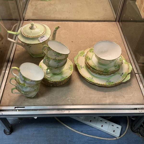 Vintage Aynsley tea service with floral pattern and pastel green colour.