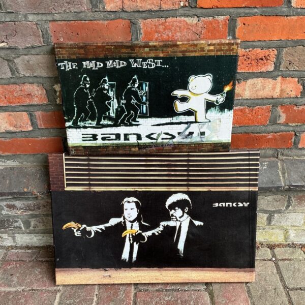 Banksy street art canvas prints depicting a scene with figures.