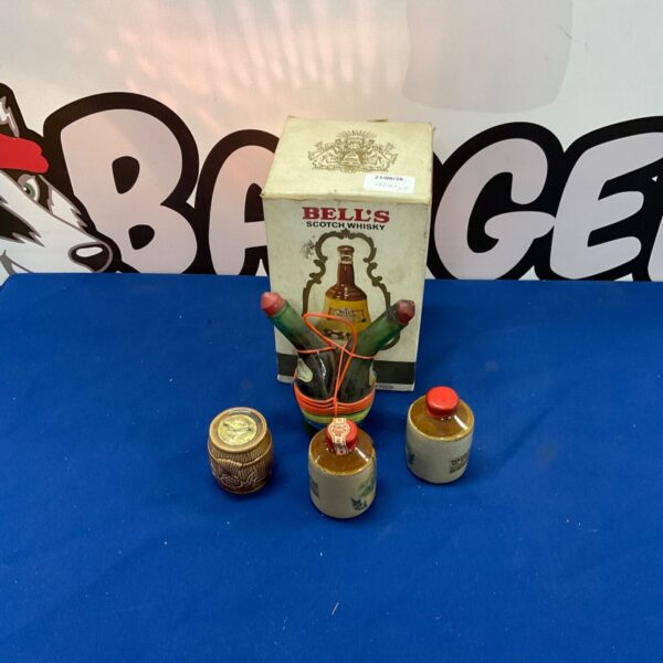 Vintage Bells Whiskey bottles and stone miniatures for collectors.