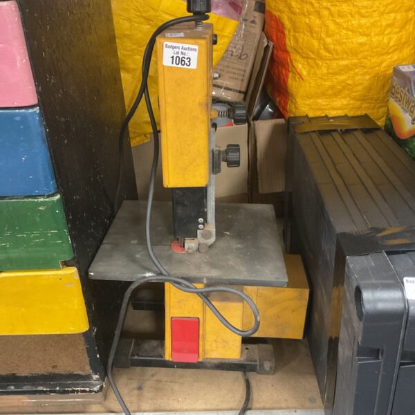 Yellow and grey benchtop bandsaw for metal and DIY projects.