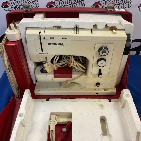 Vintage Bernina Record sewing machine in red case.
