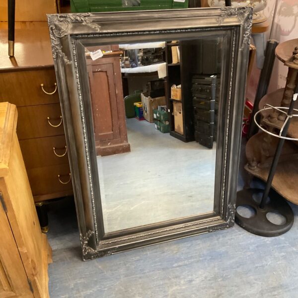 Ornate framed bevel edge mirror, 40x28 inches.