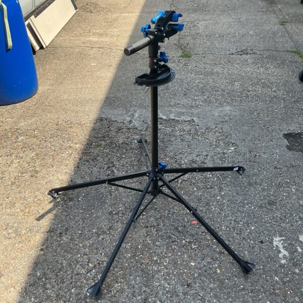 Black BikeMate bike repair stand for bicycle maintenance.