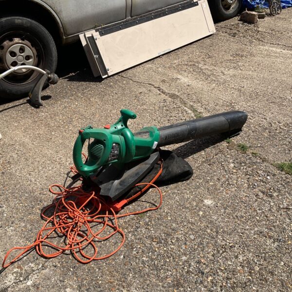 Used Black and Decker garden vac with orange cable.