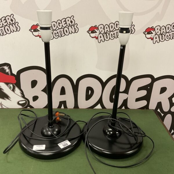 Pair of black bedside table lamps without shades.