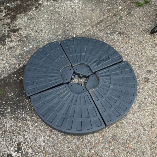Black weighted parasol base for garden shade and outdoor stability.