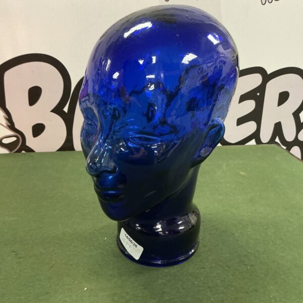 Vintage blue glass mannequin head for hat or wig display.