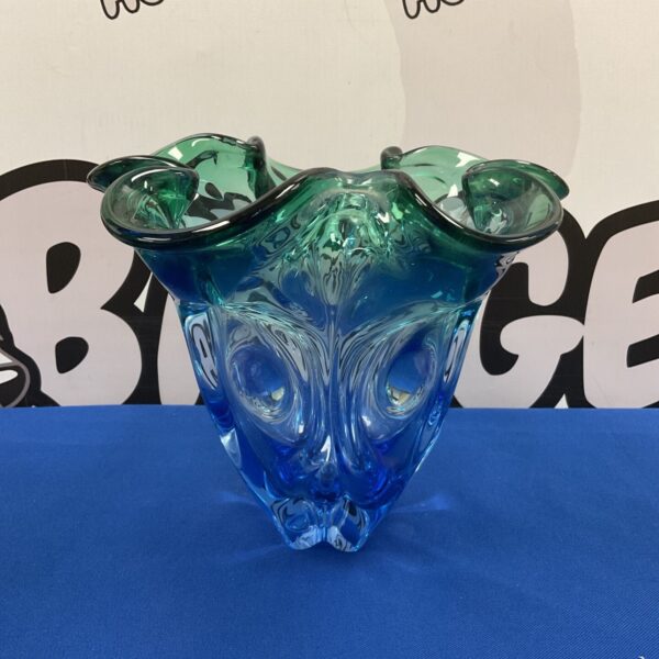 Striking blue and green art glass vase with sculptural form.