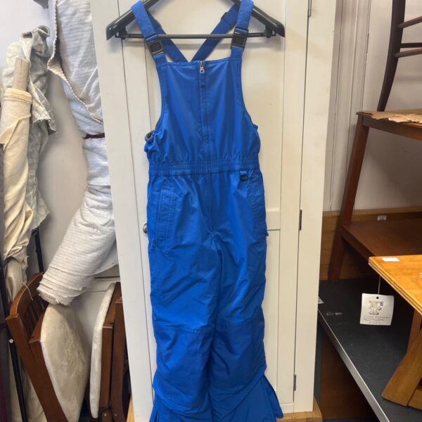 Blue waterproof salopettes with adjustable straps for outdoor activities.