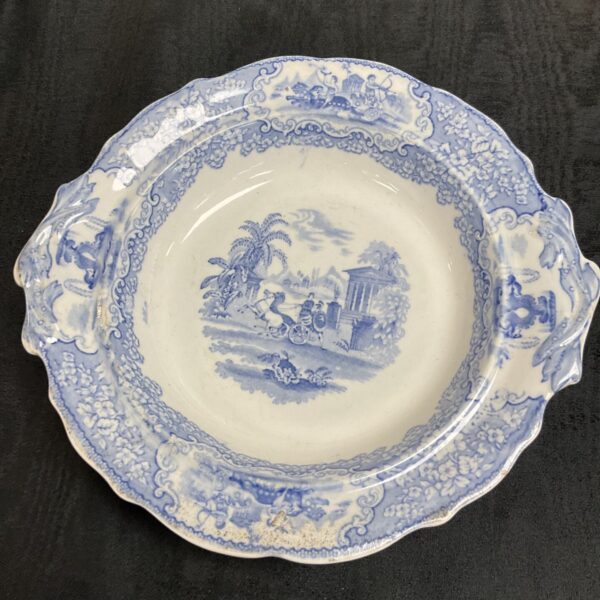 Antique blue and white transferware fruit bowl with landscape scene.