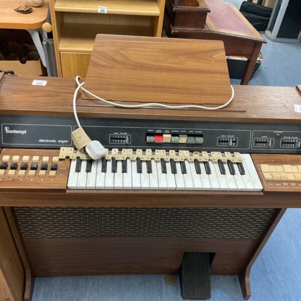 Vintage Bontempi electronic organ with keys and controls.