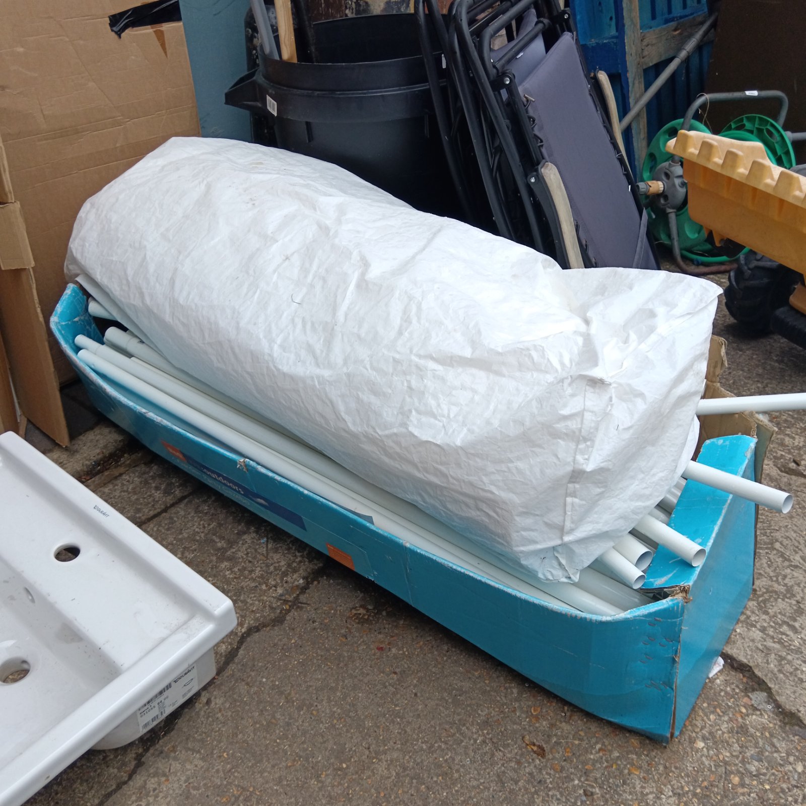 B&Q garden gazebo in original packaging, ready for outdoor use.