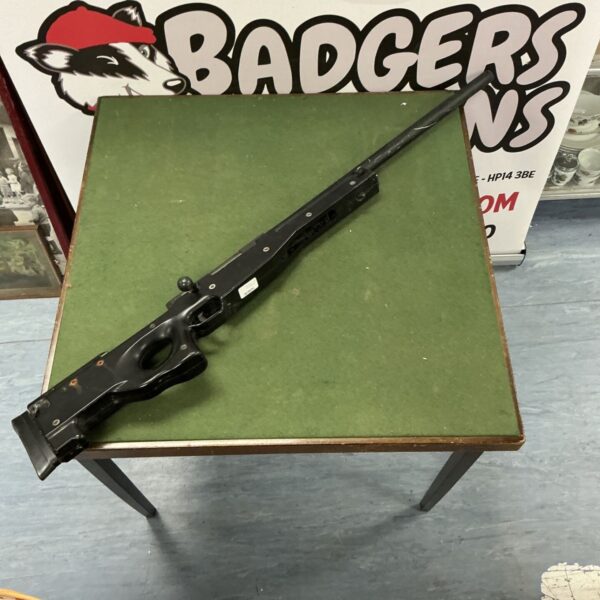 Vintage BSA bolt action air rifle with wooden stock.