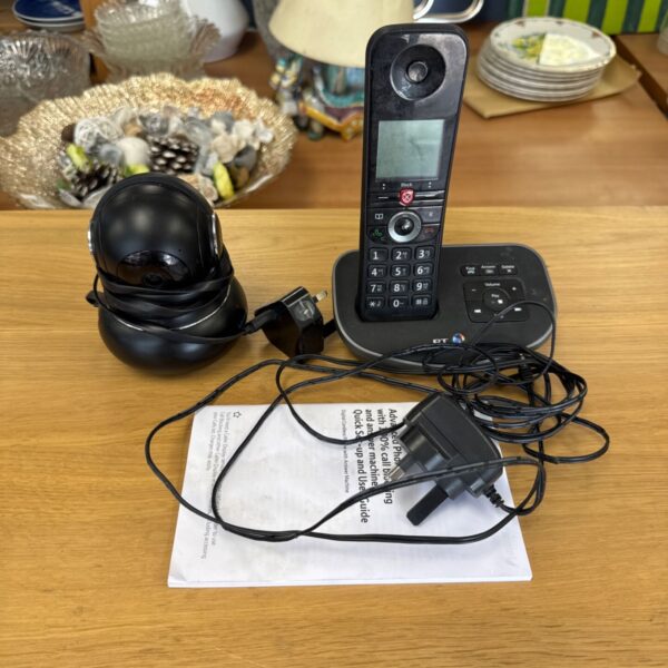 BT cordless phone with manual and Litokam camera on a table.