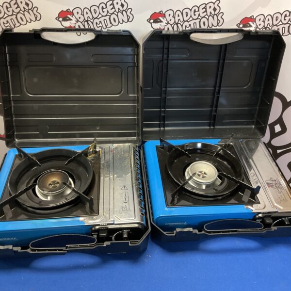 Two blue portable camping gas stoves with burners.