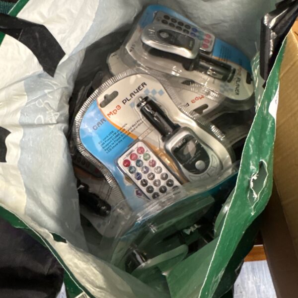 Car MP3 player adapter with digital display and controls.