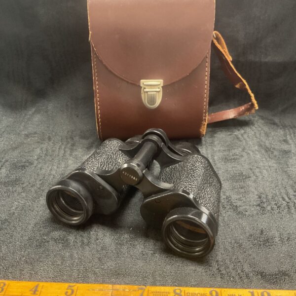 Vintage Carl Zeiss Jena binoculars with leather case, side view.